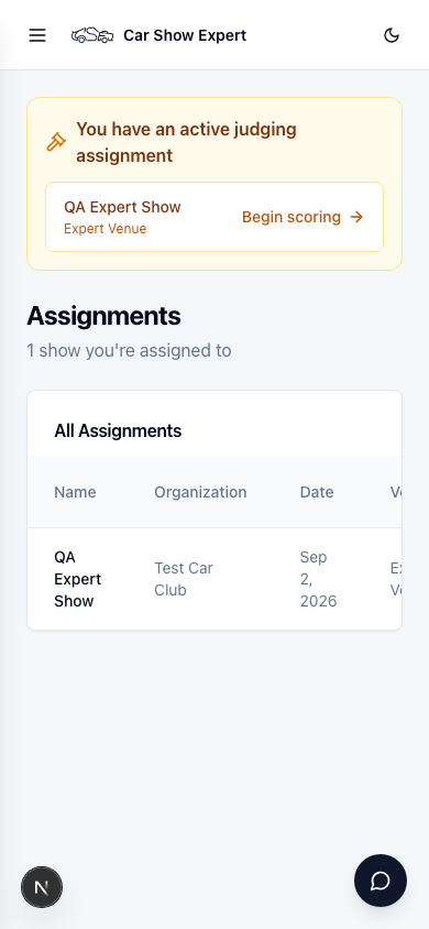 Assignments page on a phone showing an active judging assignment banner with a Begin scoring shortcut, and a table listing the assigned show